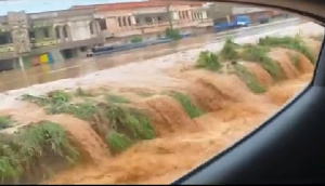 Flood waters were gushing from the sides of the road