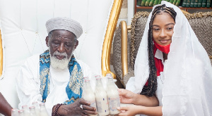 An official of Vitamilk Ghana making a presentation to the Chief Imam