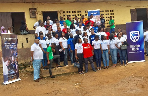 Staff of Stanbic Bank and other volunteers in a group photo after the event