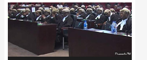 Lawyers representing the different parties are listening to the ruling