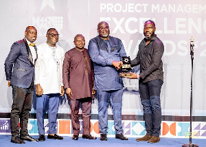 William Tetteh, Chief Capital Projects Officer receiving Telecom Project of the Year Award