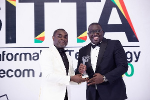 Andrew Takyi-Appiah, right, receiving the Best Fintech CEO of the Year award