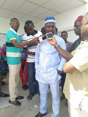 Abdul-Aziz addressing the press at the registration center at Mion