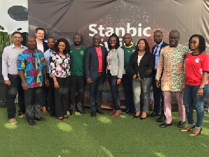 Some staff of Stanbic Bank in a group photo after the programme