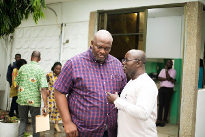 Greater Accra Regional Minister, Henry  Quartey interacting with Mr Assibey Antwi