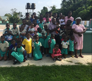 The manager with some kids of the orphanage in a group photo