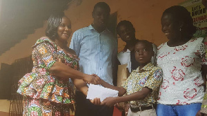 Prosper Diapim of  Mawuli Basic School receiving his price