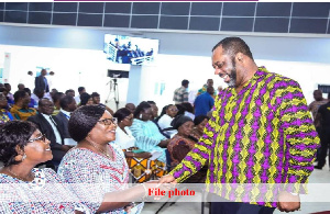 Dr. Matthew Opoku Prempeh in a handshake with GNAT executives.