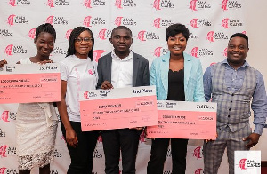 Winners of the AmaCares 'Start-up Fund' competition displaying dummy cheques