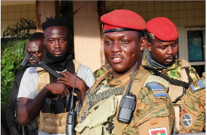 Burkina Faso's military leader Ibrahim Traore being escorted by soldiers