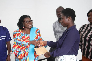 Sandra Owusu Ahinkorah making a presentation to one of the students