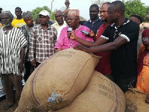 Alhaji Mobila (middle) presenting the items to the victims