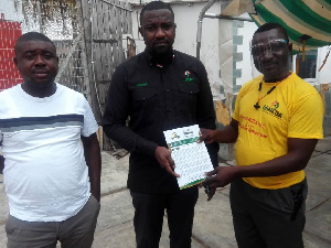 Team presenting the NCDs document to Ayawaso West Wougon parliamentary hopeful, John Dumelo