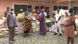 Nana Amponsah Dokua III presenting the items to a health facility