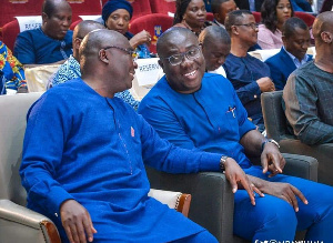 Sammi Awuku (right) sitted with Dr. Mahamudu Bawumia