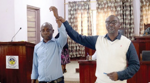 Castro Asumadu-Addae(left) as the new presiding member for the municipal assembly