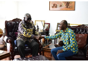 President Kufuor in a handshake with founder of the Awards, Kojo Hayford