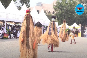 Masquerades dancing at Rawlings' mother's funeral