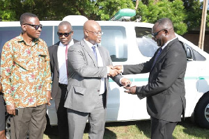 Keys to the ambulance being handed over during the donation