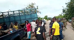 Some of the victims being carried away from the accident scene