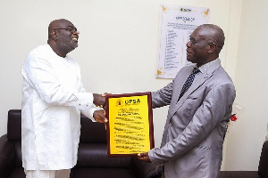 Dr. Kwadjo Obeng presented with the citation of recognition