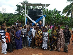 Maji Sunil Lalvani and the MCE in a photo with elders of Denteng, Akwaboa and Hwiede