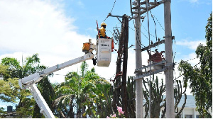 A Kenya power technician repairs a transformer