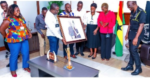 Dr George Akufo Damapre, (IGP) receiving his award