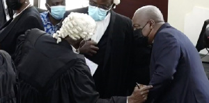 Former President Mahama with his lawyers at the Supreme Court