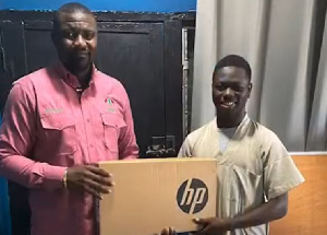 John Dumelo with some of the beneficiaries of the laptop