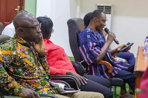 Vice-Chancellor of STU, Ing. Prof. Kwadwo Adinkrah-Appiah with a microphone addressing students