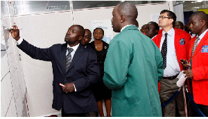 Brokers trading at the Uganda Securities Exchange.