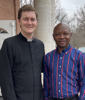 Ras Mubarak shares a photo with the priest at the St. Lauren Anglican Church in Texas