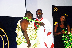 Ebo Quansah receiving an honorary award on behalf of Kofi Coomson