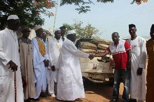 MP for the area, Joseph Kofi Adda presenting items to the Central Imam, Murabbi Akolbila