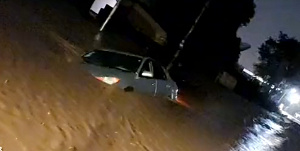 Car submerges in the flood