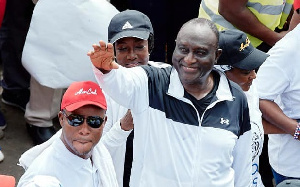 Sly Tetteh in shades with Alan K during an 'aduro wo so' march in Accra