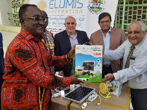 Agriculture Minister, Dr. Afriyie-Akoto receiving the kits from officials of the Foundation