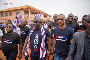 Amankwa-Manu walking through the town with some supporters after submitting his nomination