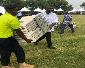 Sammi Awuku with a few others cleaned and re-arranged hundreds of chairs for visitors to sit on