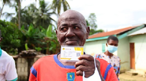 Opanyin Kwabena Nkrumah holding his SSNIT Card