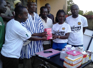 Madam Esther Coffie presenting the assorted medical supplies items to Naa Baligi III