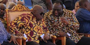 Akufo-Addo confers with Alan during a function