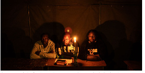 Election agents wait for the polls to close at a polling station during Zimbabwe's election