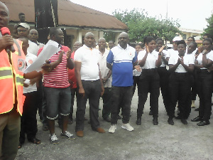 Members of New Juaben Municipal Assembly and NADMO in a group photo after the clean-up exerise