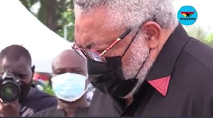 The late Former President Jerry John Rawlings in a solemn mood at his mother's funeral