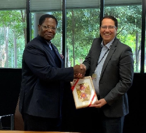 Professor Tony Travaglione, the Interim Deputy Vice-Chancellor with H.E Dr.  Joseph Agoe